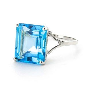 14K. SOLID GOLD RING WITH OCTAGON BLUE TOPAZ